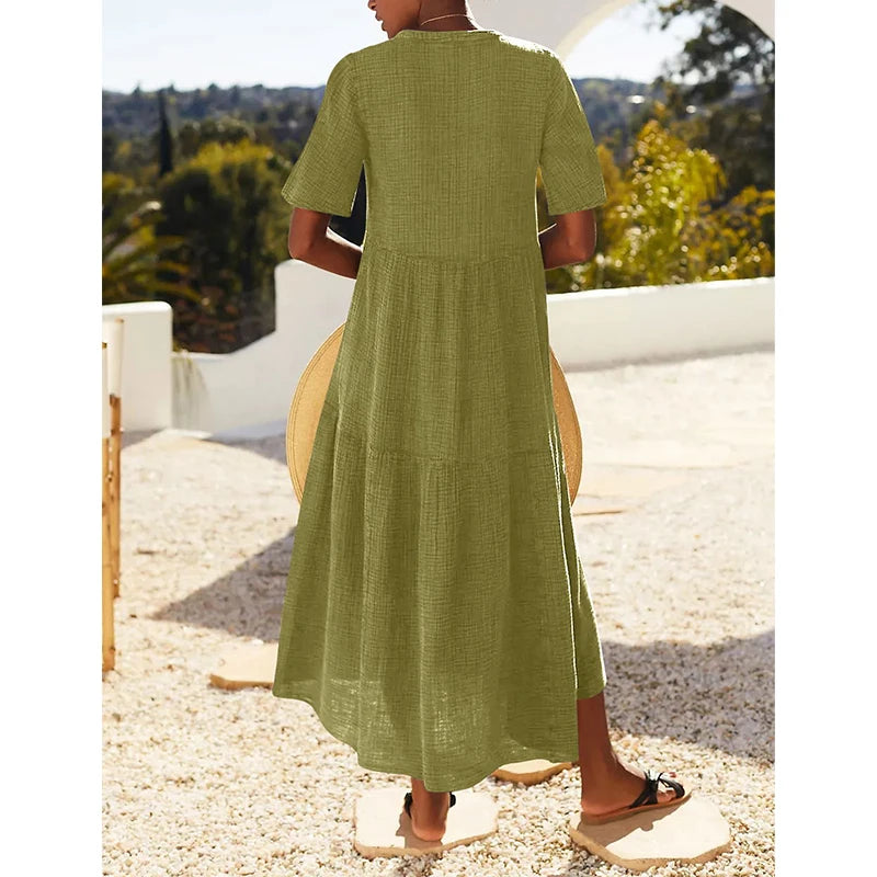 Muślinowa sukienka midi z krótkim rękawem i dekoltem V – lekka sukienka na lato