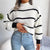 Damski sweter z golfem w paski