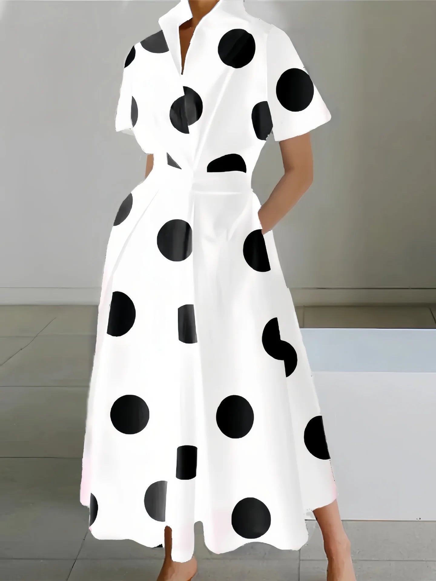 Minimalistyczna sukienka midi bez rękawów z kołnierzykiem – elegancja w nowoczesnym wydaniu