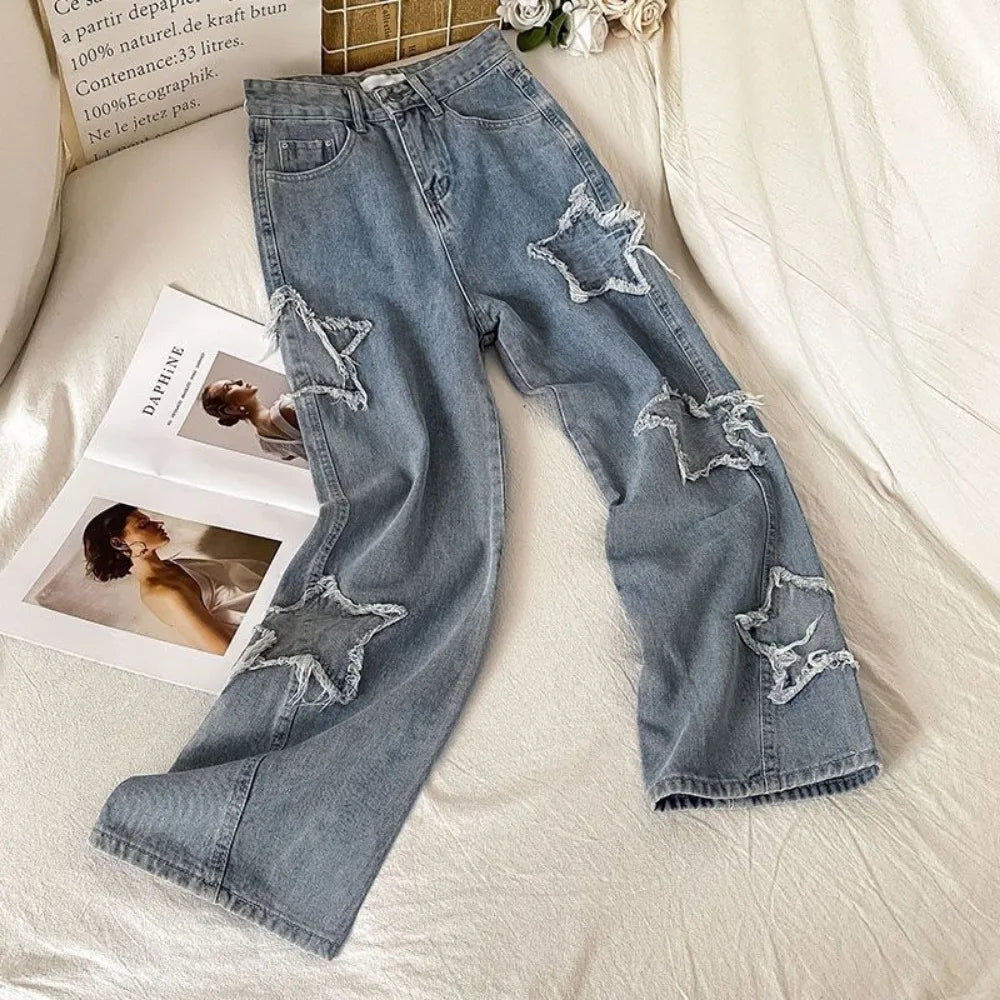 Damskie spodnie jeansowe z naszywkami w gwiazdy