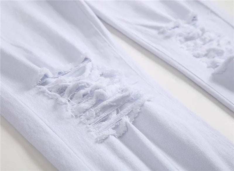 Białe jeansy męskie z przetarciami slim fit