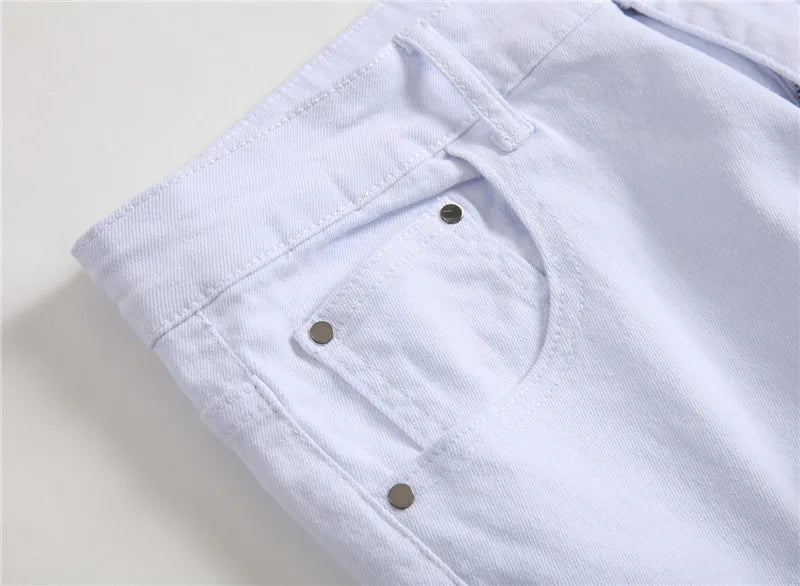 Białe jeansy męskie z przetarciami slim fit