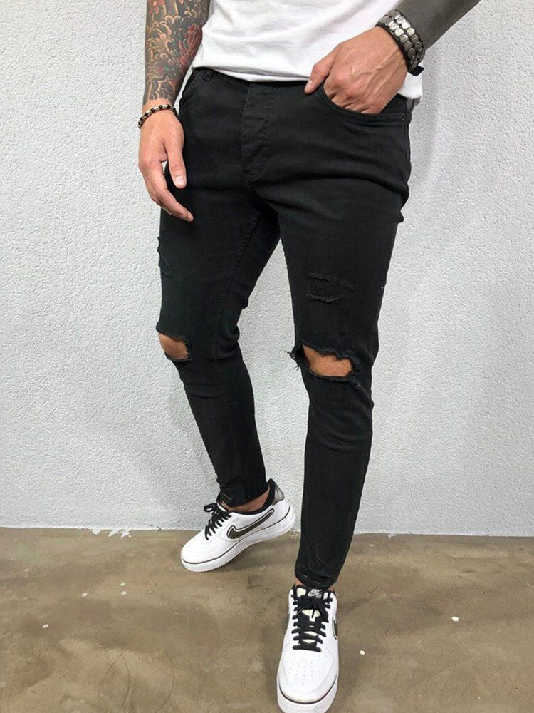 Męskie jeansy skinny fit z przetarciami i dziurami